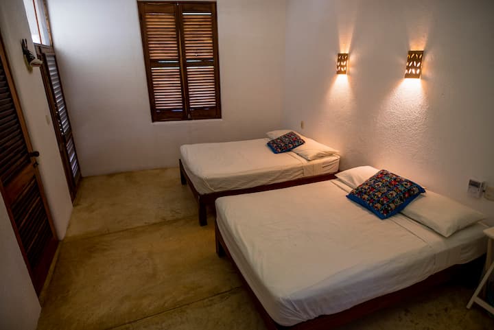 Bedroom 2 
Two queen beds; this room connects with bedroom 3 via the bathroom. This can also be locked for privacy.