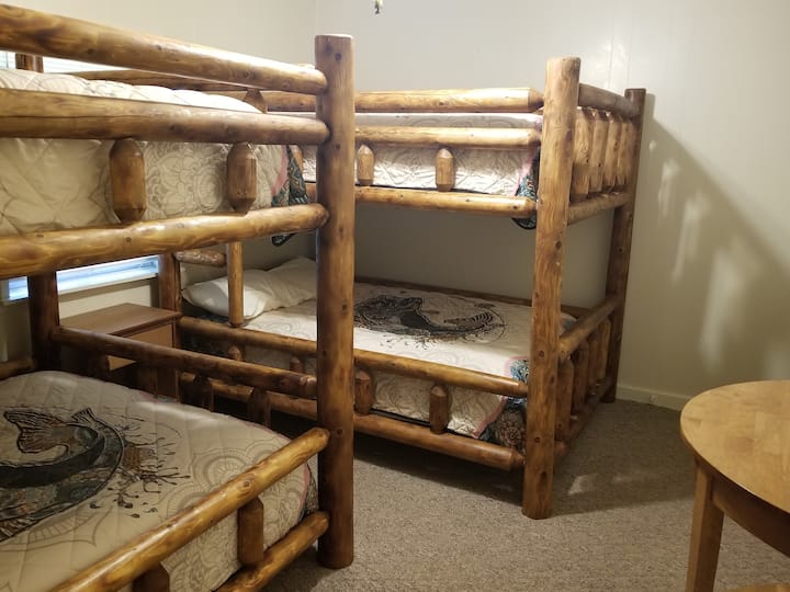 2 full over full cedar bunk beds. Has a walk in closet.