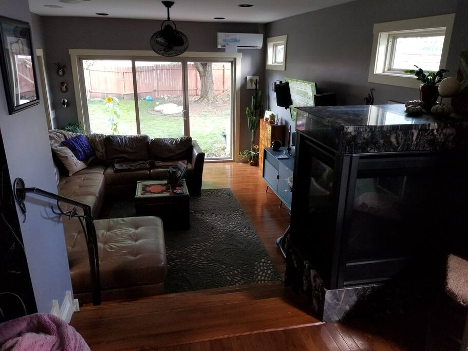 Sliding Glass door leading out to large private fenced in back yard with two patios