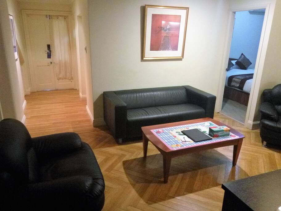 Living area with 32" LCD TV, couch & armchairs