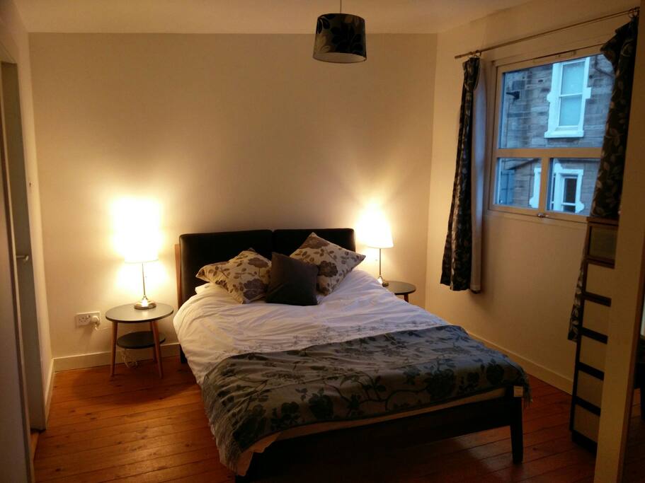 Main bedroom with on-suite shower and toilet.