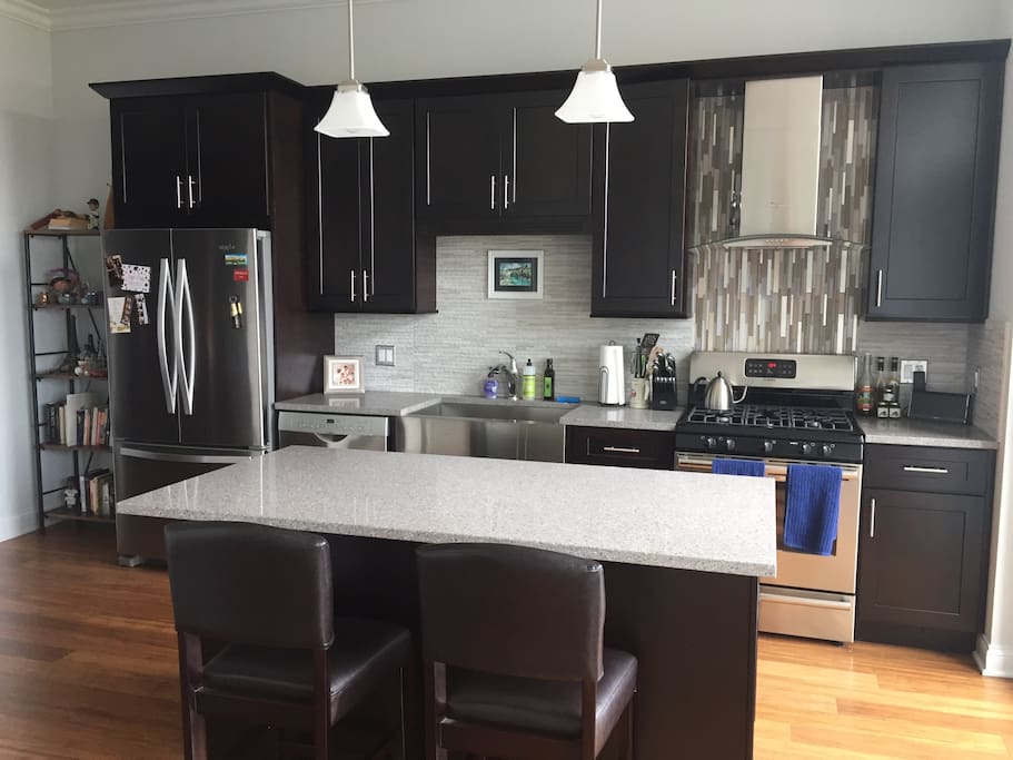 Brand new kitchen - feel free to cook! 5 range stove, microwave, garbage disposal, farm style sink.