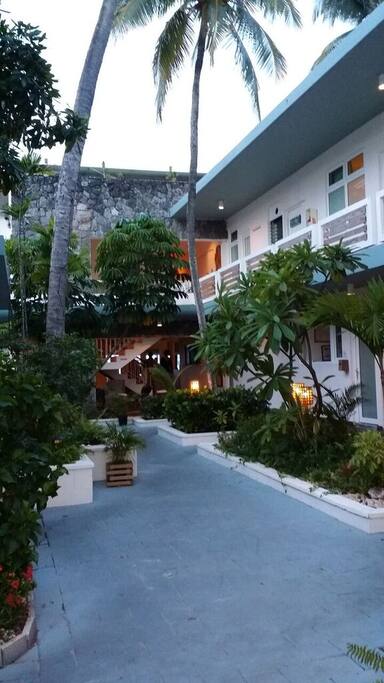 All of our rooms overlook this lush courtyard and Isla Verde Beach is just across the street.