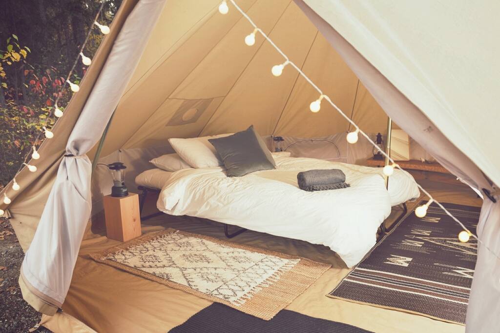 A comfortable and cozy queen bed welcomes you after a day of adventures.