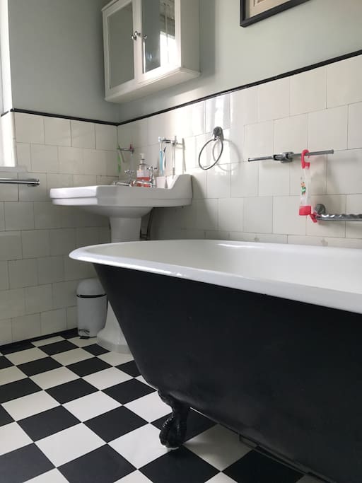 Downstairs bathroom with roll-top bath