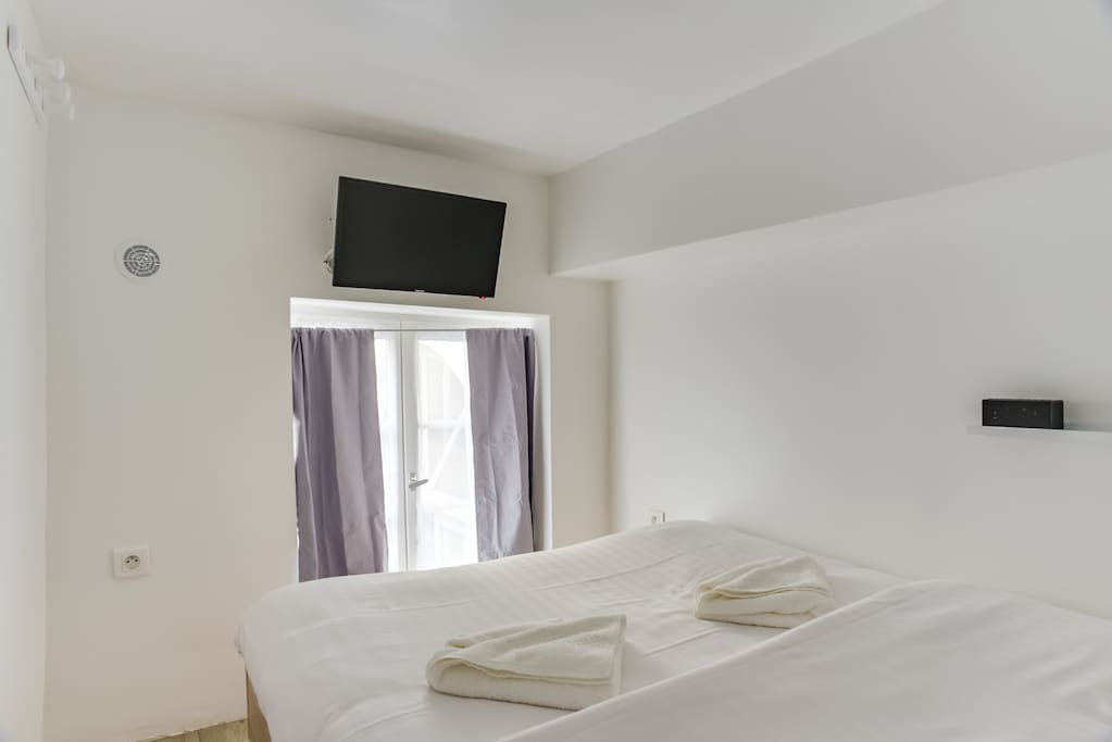 The bedroom with a TV