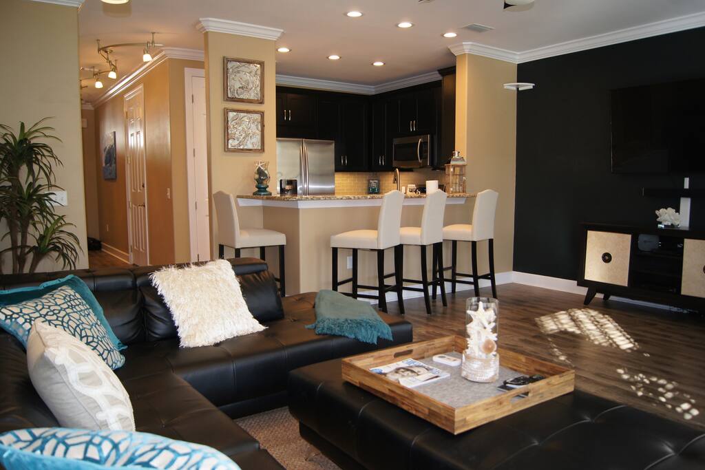 View of your kitchen from the living room, complete with wifi, DirectTV, Netflix, Hulu, and 65" smart TV