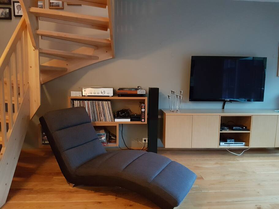 Stairs to go up to the rooms, TV and relaxing corner