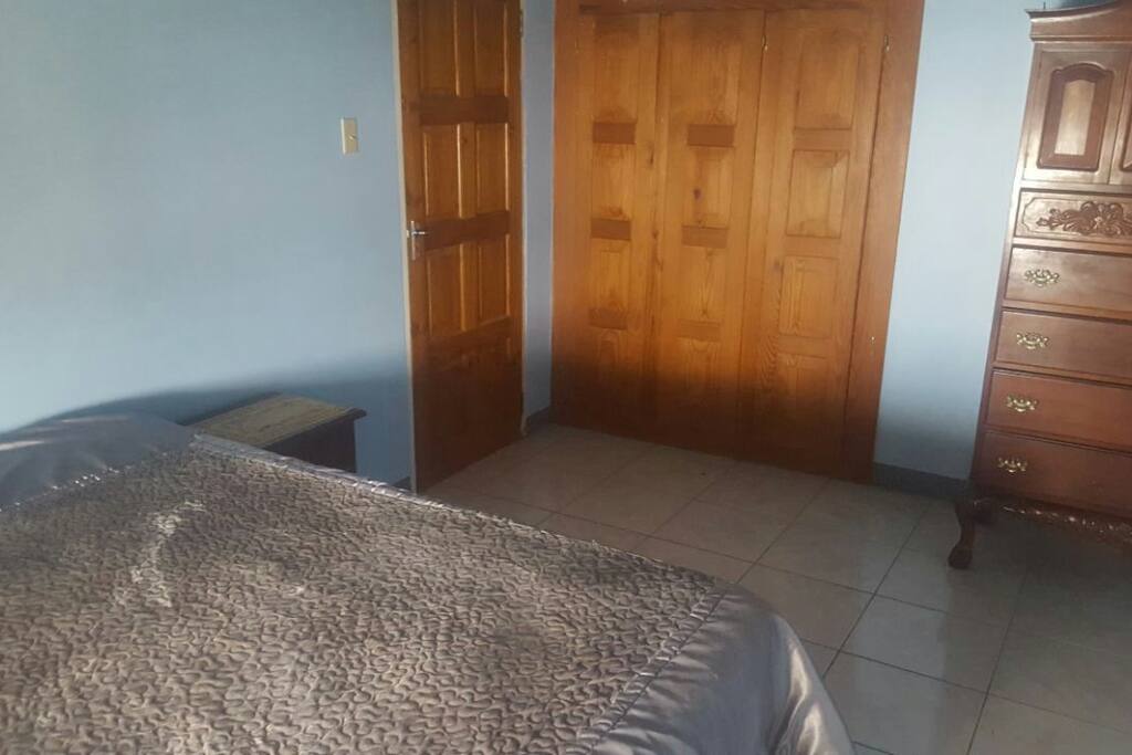 Private bedroom with own closet, bathroom and chest of drawers for personal items to be stored.