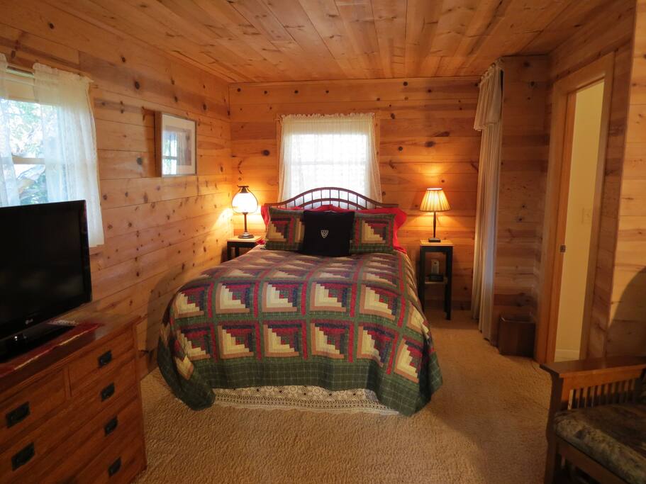 Queen sized bed with a feather-bed and down comforter.