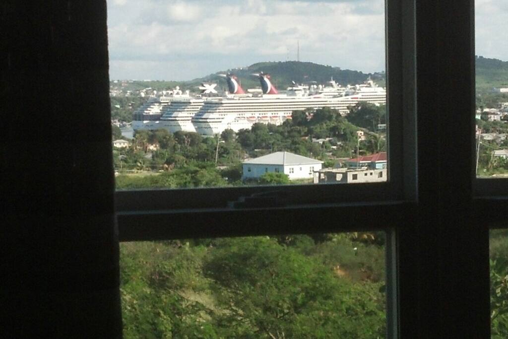 view of ships in the harbor from bedroom window