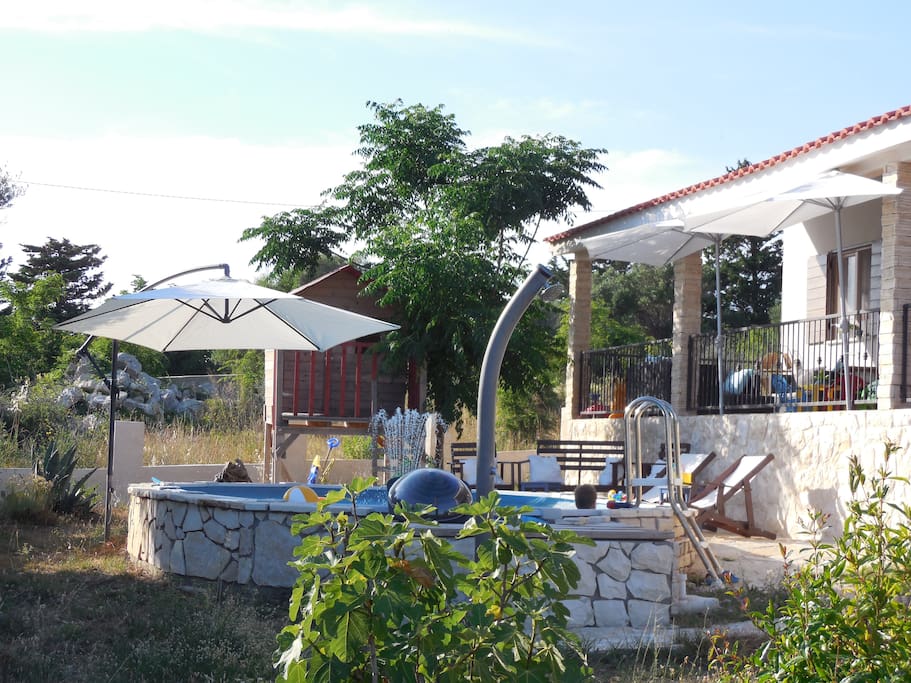Front side and garden with pool