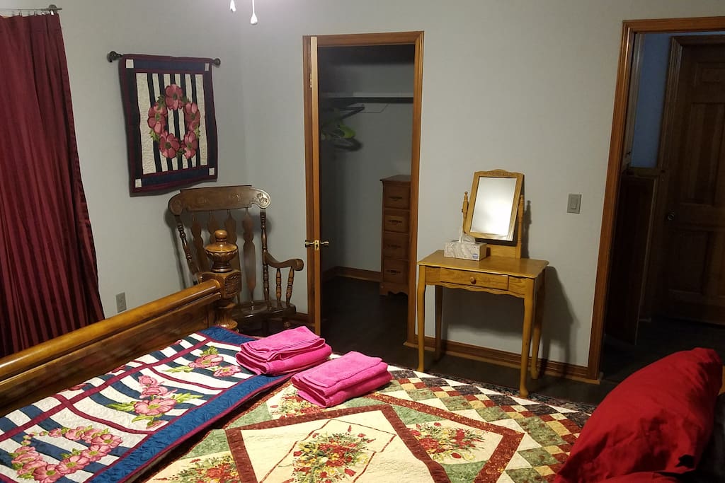 The Rose Room has a queen sized bed and two windows. It also has a large walk-in closet.