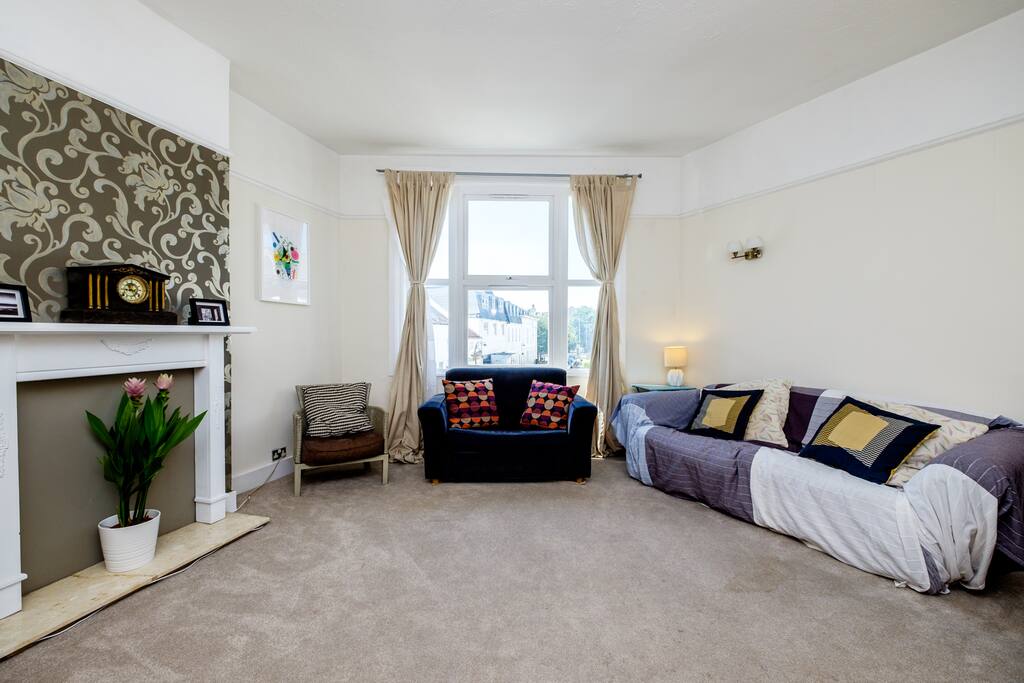 The living room is really spacious and comfortable with seating for 6+ people and a dining table