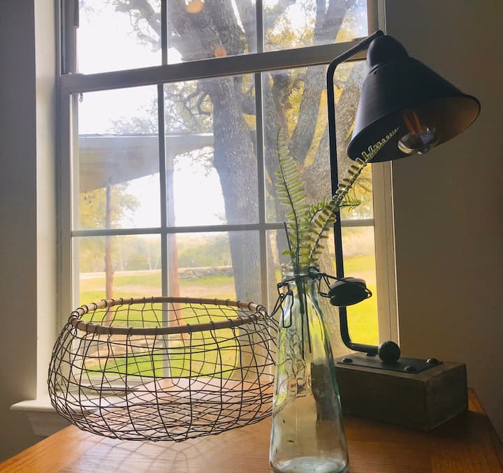 Sometimes it's the little things that make us smile. Like a delicate wire basket from Magnolia, a single stem  in a vase, or a view from a window.