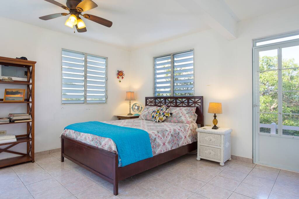Bright and airy! Bed and entrance to the side balcony