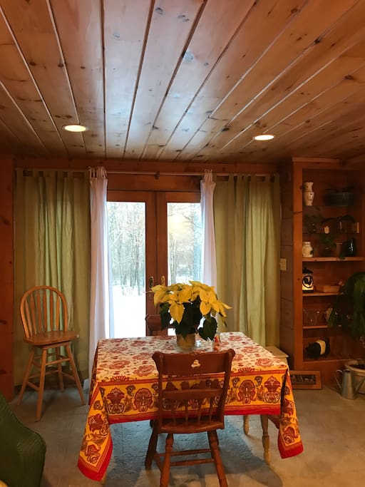 Dining, game, puzzle area and atrium doors leading out to yard, this is the entrance in three seasons for guests to use, in the winter guests will enter from main front door or inclement weather.