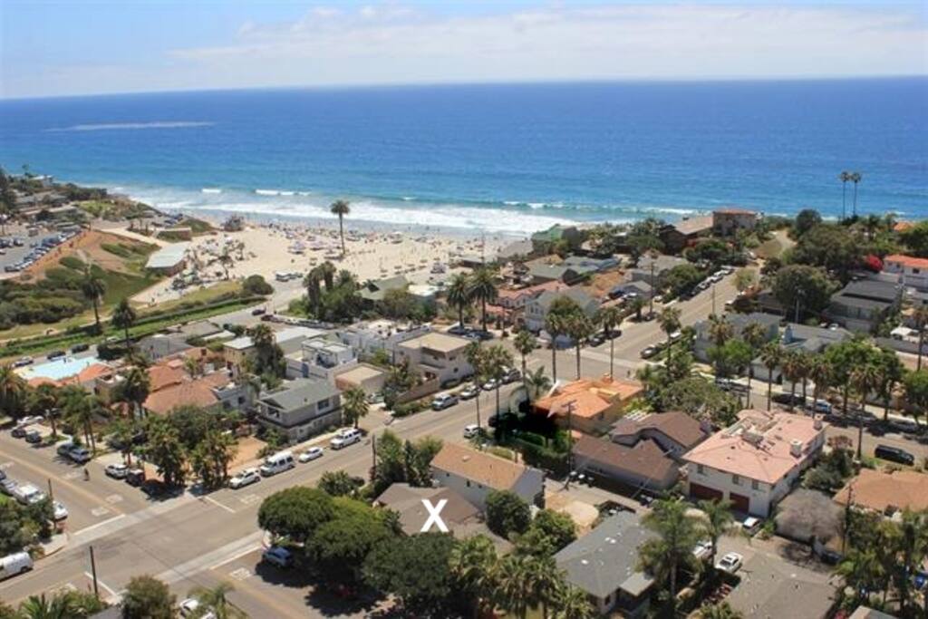 X marks the spot where this house is located! Easy 2 minute walk to the beach.