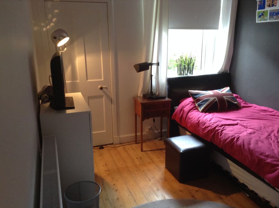 Bedroom with adaptable bed, providing flexibility as converts into one single or can be arranged as 2 single beds