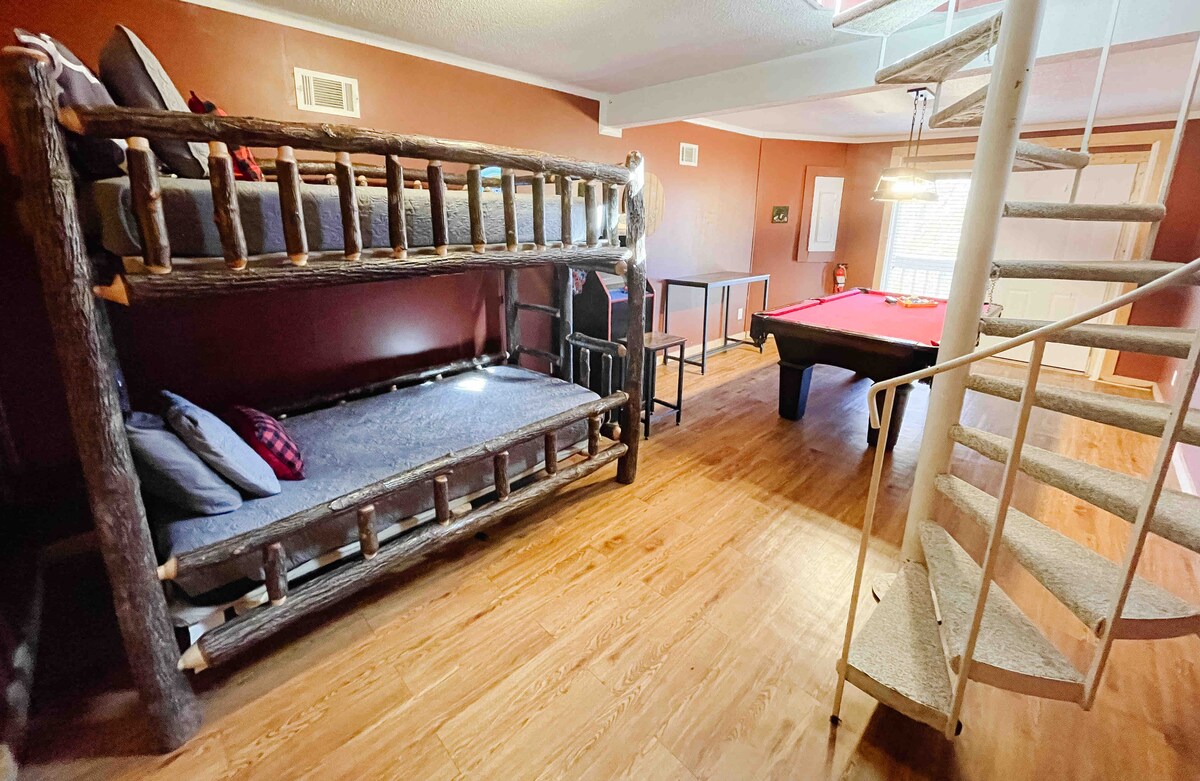 Bunk beds, a pool table, a new Roku TV,  and a multicade featuring dozens of classic arcade games make this downstairs bonus area the best hang out spot in the house.