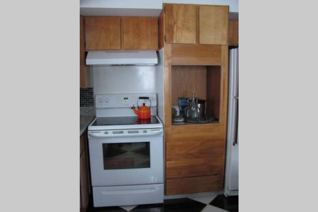 The shared kitchen is stocked with spices, homemade kombucha, farm-fresh eggs, yogurt, granola.