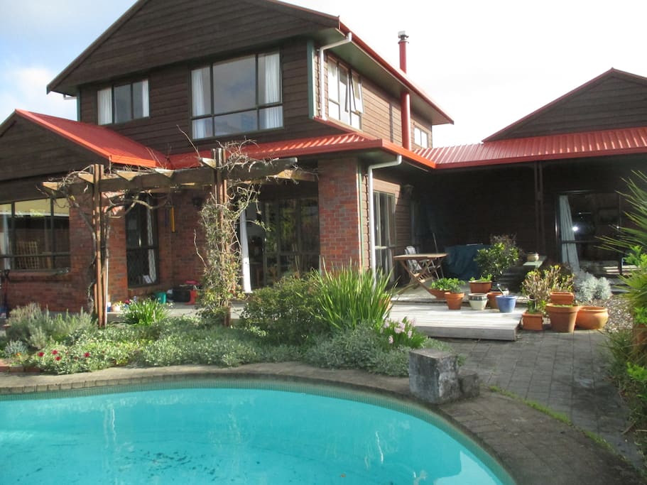 Verandah, garden and pool area