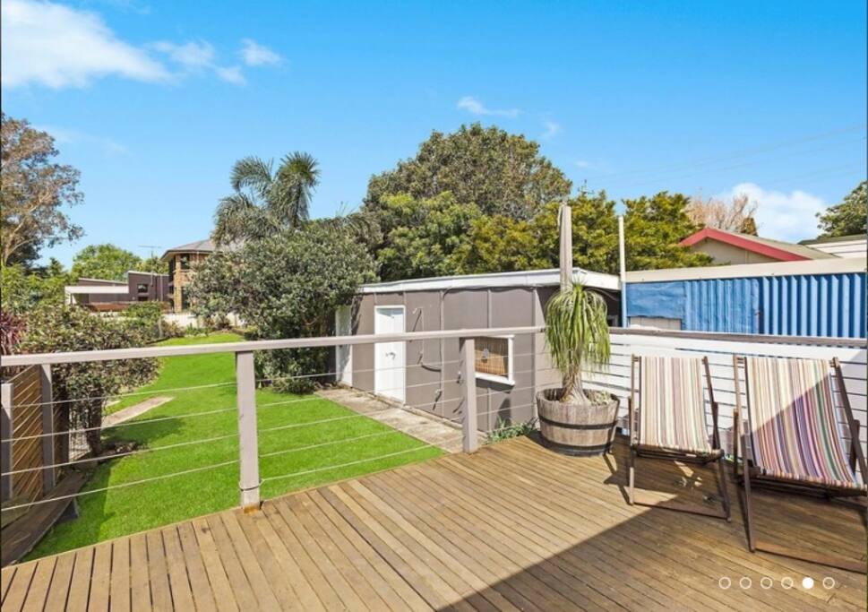 Backyard parking for one spot. Awesome for cartwheels. Note: Three steps to get up to the deck. If stair-free access required, park on the street and access via front door, but note: the laundry is accessed outdoors grass level. Granny flat may be in use by property owners, if you need more accommodation than available in the house, contact us. Photo credit: McGrath Real Estate.