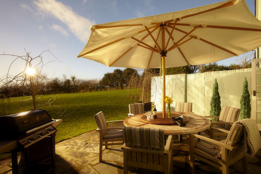 Private sun drenched terrace and large fenced garden