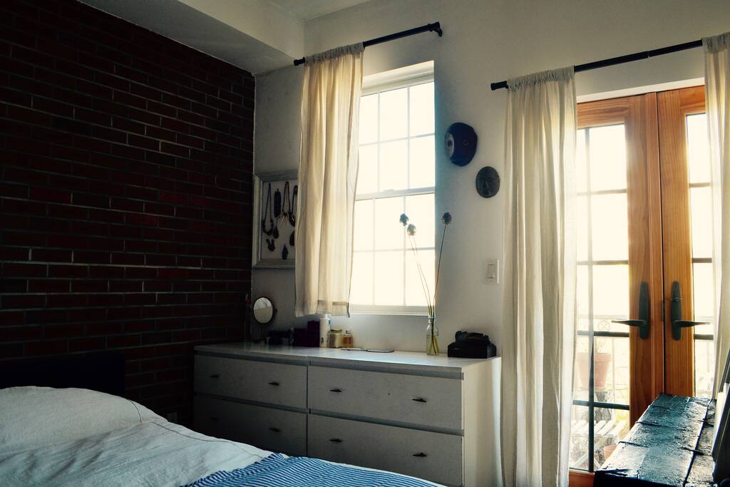 The bedroom (comfortable full size Summerfield mattress) with French windows.