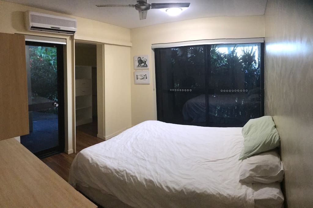 Master bedroom with queen bed, secluded and surrounded by garden.