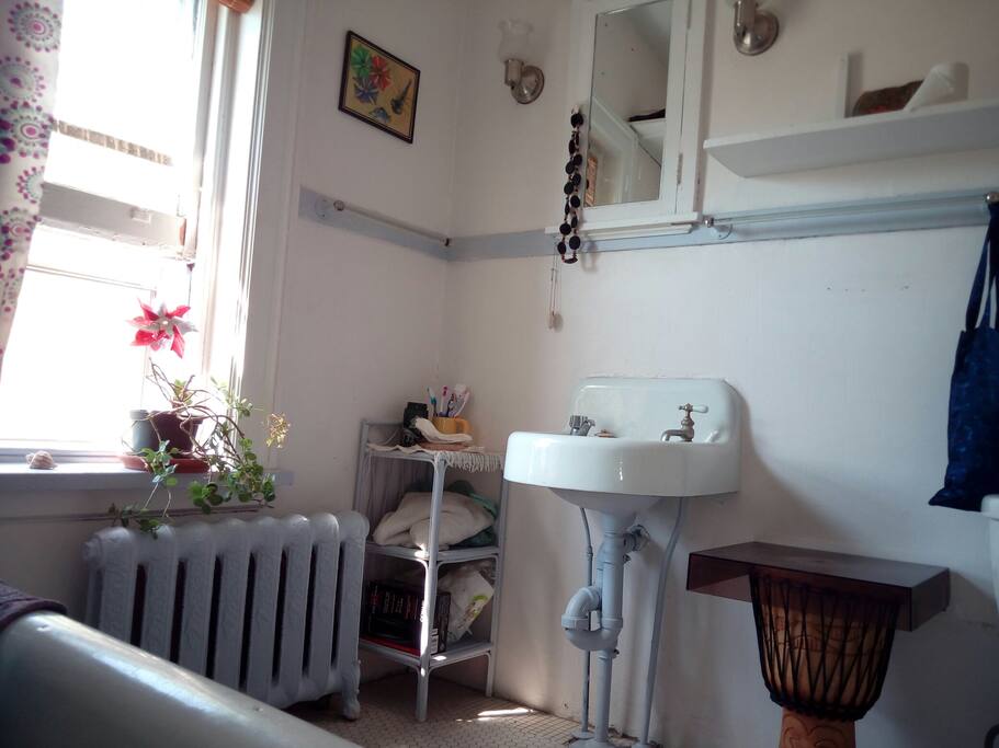 Well lit bathroom with old charm.