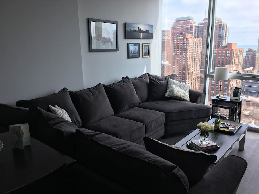 Floor to ceiling windows w/ lake views throughout, sectional couch