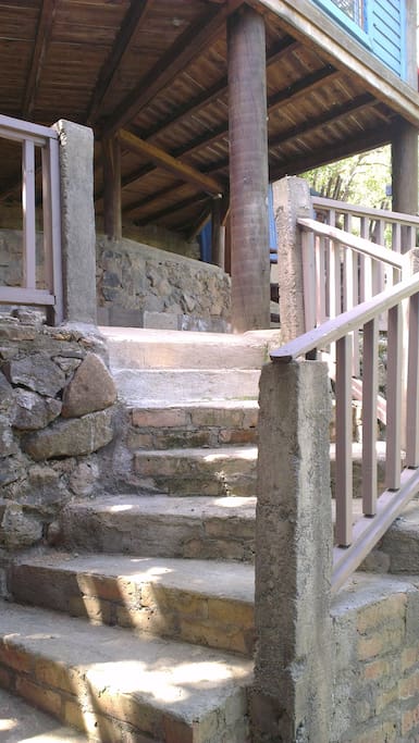 Lower level with rocking chairs and BBQ