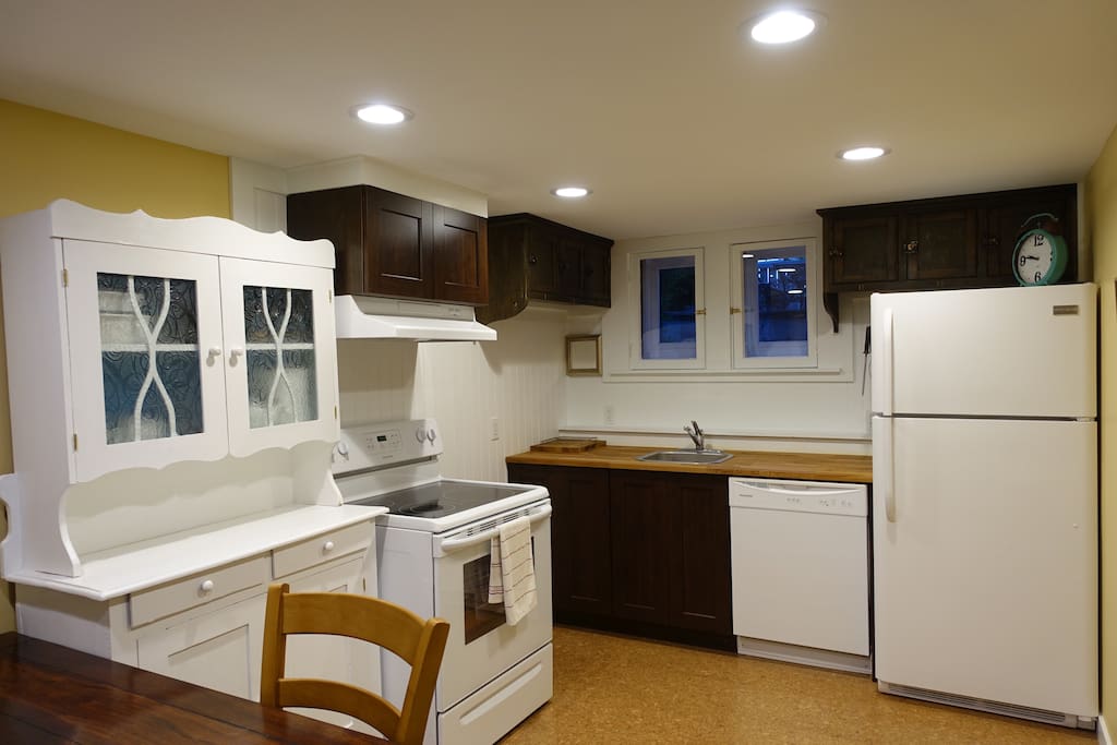 Bright, cheerful, windows and plenty of storage, full sized kitchen (fridge, d/w, stove).