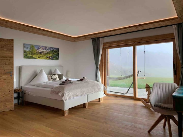 Bedroom 2 with large sliding glass door to the garden