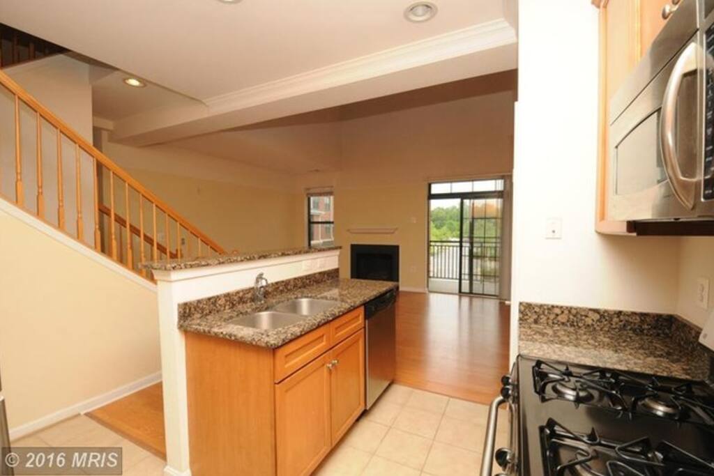 Kitchen and living room - fully furnished since image was taken. Guest bedroom and bathroom are on the opposite side of the far left wall.