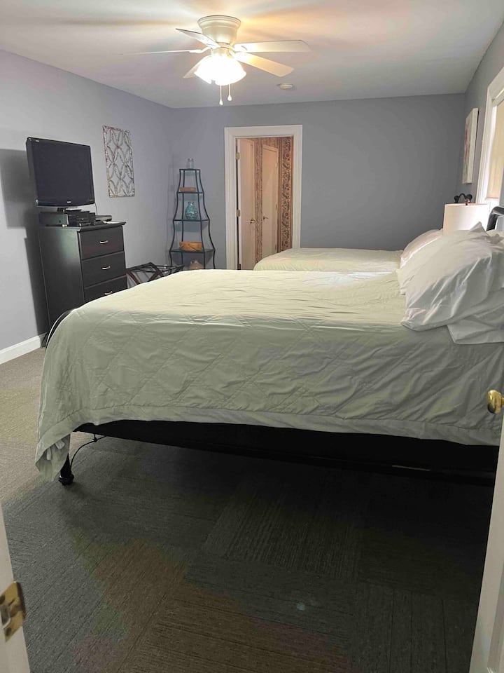 Bedroom 3-2 double beds and television.  This also shows the attached bathroom.