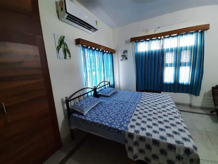 Beautiful room with windows on 2 sides and attached balcony. 
It has new split AC to keep you calm in hot summers and is well equipped workstation & excellent wifi speed for your uninterrupted working
