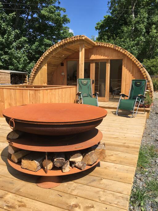 Large decking area with fire pit and hot tub