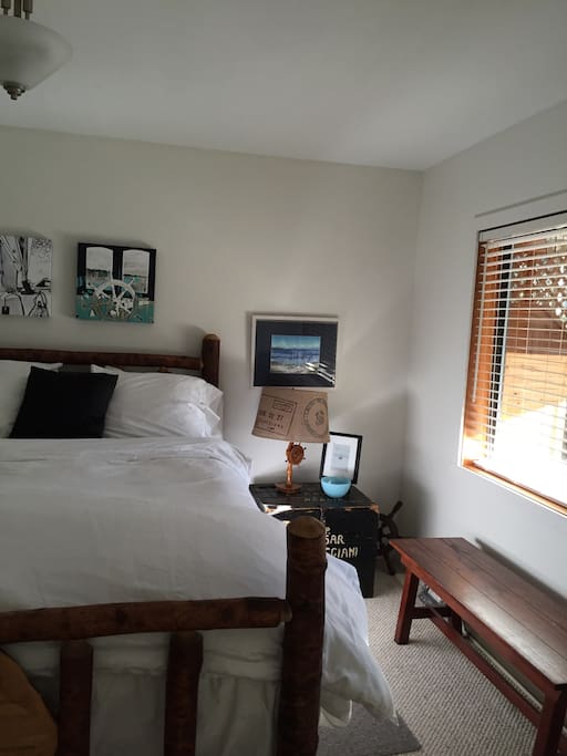Bedroom 1 beautiful log bed made by local artisan .