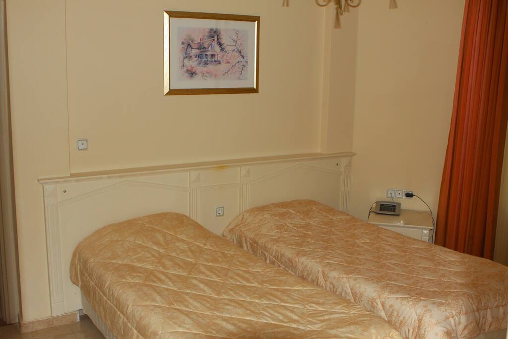 Orange bedroom. Beds can be combined in one bed.