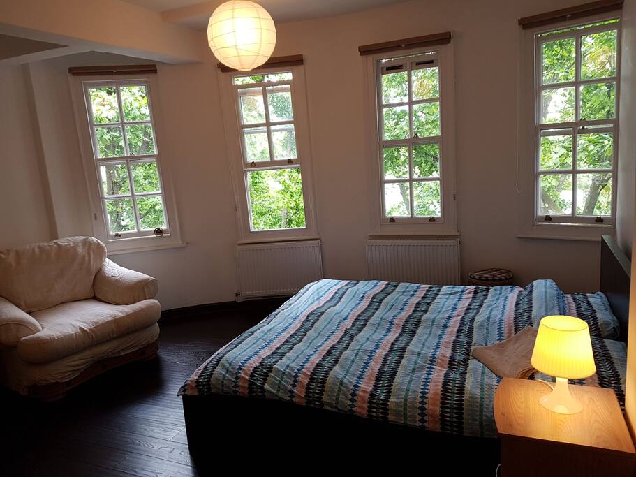 A very nice room with a lounge area and workspace