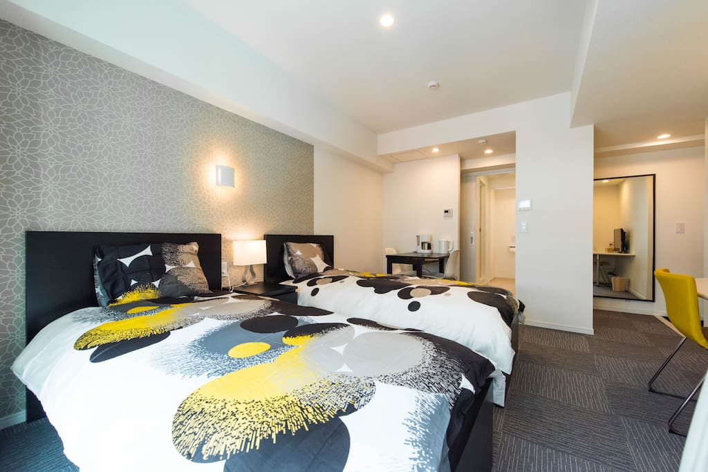 Bedroom with 2 single beds and natural sunlight