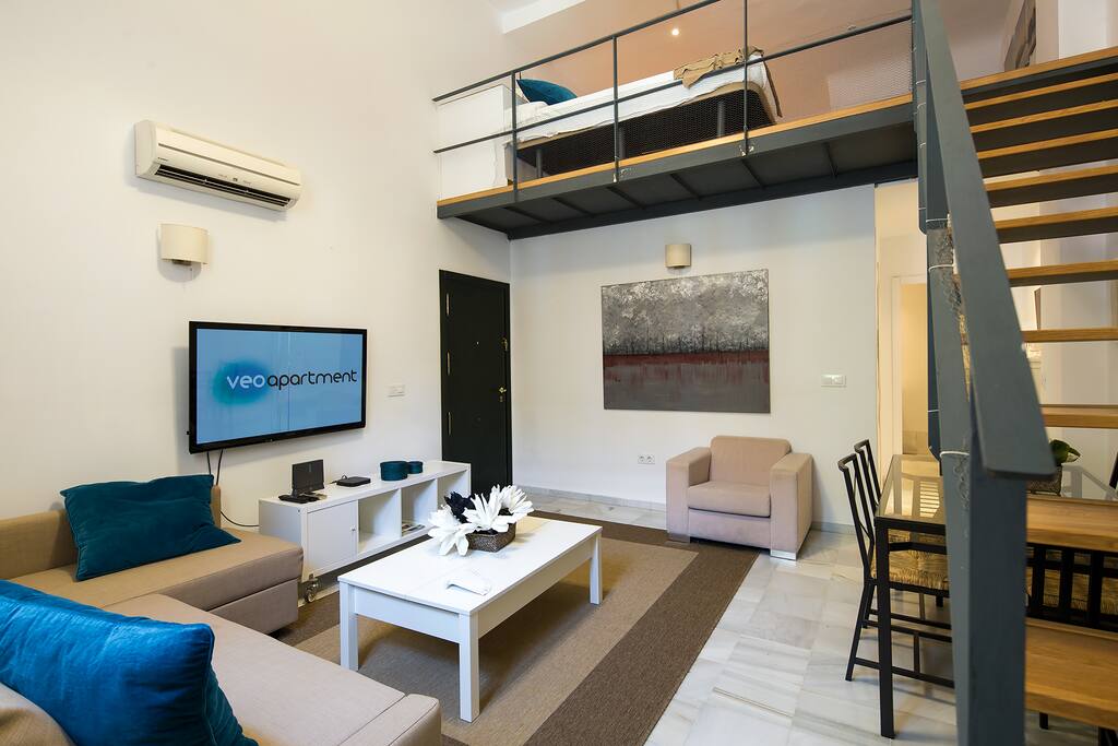 Living room. The bedroom is on the upper level.