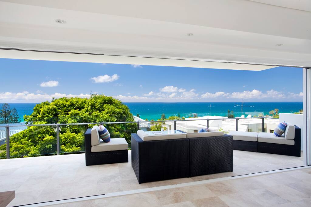 covered balcony with outdoor lounge