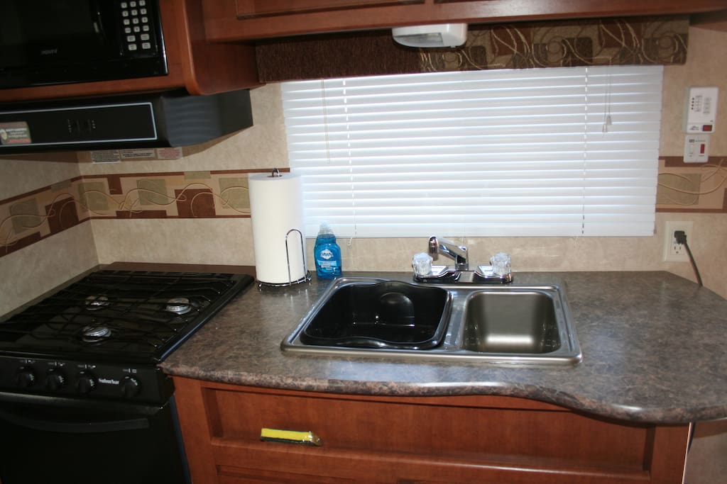 Our trailer comes with a stove, sink, refrigerator, oven