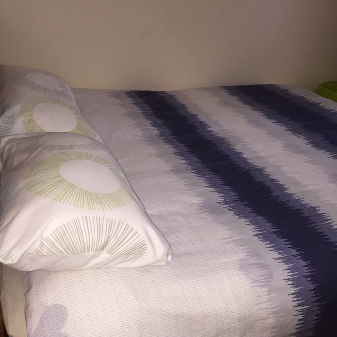 Queen size bed in one of the bedrooms