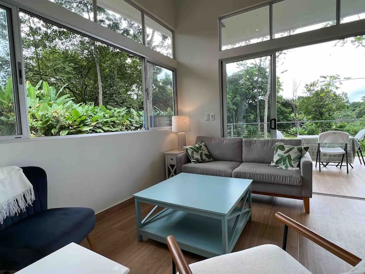 Living Room features a comfortable small couch that is easy to sleep on for one person. 