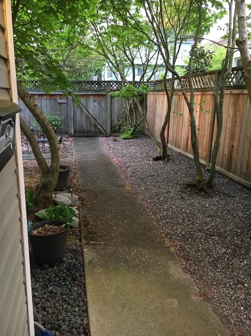 Enclosed private yard with outdoor seating area in quiet Ballard.