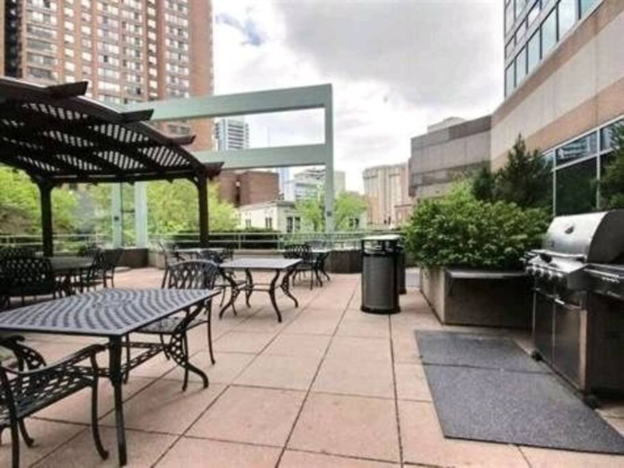 outdoor bbq with huge balcony and sitting area